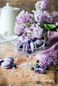 Blueberry macaroons on a glass stand