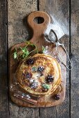 Traditional American pancakes with berries and maple syrup