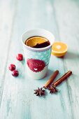 Cherry mulled wine in a porcelain mug