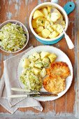 Pork schnitzel with braised cabbage and potatoes
