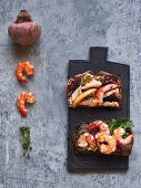 Wholemeal bread with herring salad and olive tapenade with prawns