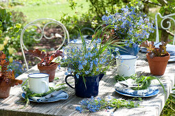 Table decoration with forget-me-nots and salad