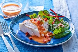 Cod with pepper sauce and salad