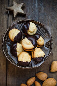 Orange cookies filled with jam and dipped in chocolate