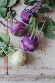 Fresh green and violet kohlrabi bulbs (top view)