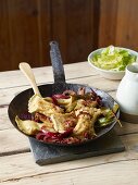 Ravioli with red onions and lettuce