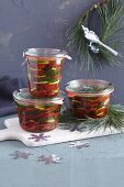 Dried tomatoes in glass jars for gifting