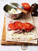 Wraps with lamb, feta cheese and tomatoes