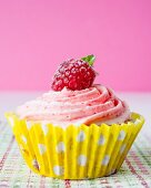 Cupcakes with raspberry frosting and raspberries