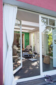 View from terrace into living room through open terrace door