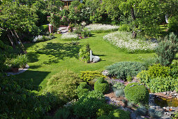 View down into cottage garden with lawns and meadow flowers