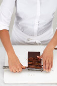 Chef chops chocolade with a knife