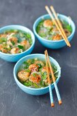 Chicken broth with meatballs and herbs