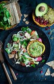 Chicken salad with avocado, pomegranate seeds, lemon and avocado dip