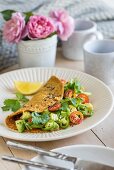 Turmeric omelette with avocado and tomatoes