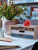Desktop drawers with decoupage fronts in different colours