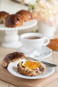 Cranberry and orange teacakes served with a cup of tea