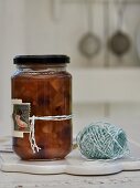 Pear chutney with cranberries in a glass jar