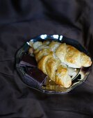 Chocolate croissants on a silver plate