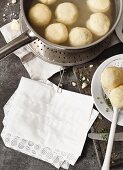 Potato dumplings cooking in a pan