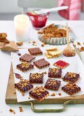 Chocolate brittle biscuits with raspberry jam