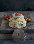 Pointed cabbage lasagne with bacon, caraway and oven-baked tomatoes