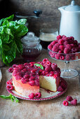 Cheesecake with raspberries in jelly, sliced