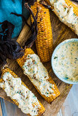 Grilled corn on the cobs with herb butter