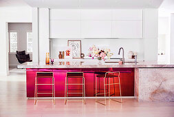 Elegant kitchen counter with marble countertop and red front