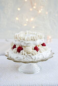 A pavlova with coconut pralines and raspberries for Christmas (second layer)