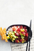 Tuna poke bowl with avocado and sesame seeds