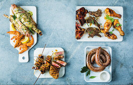 Various grilled dishes: pork, chicken, sausage, steak, fish, shrimp