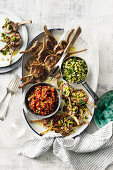 Grilled lamb chops with tomato salsa, and olive and caper salsa