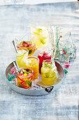 Five fruity mocktails on a tray