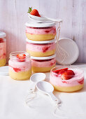 Lemon and strawberry cream in jars