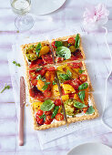 Vegetable tart with pepper, tomatoes and basil