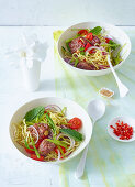 Noodle salad with minced beef and ginger (Asia)