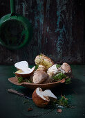 Fresh porcini mushrooms in a wooden dish