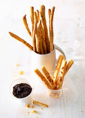 Grissini and cheese sticks with an olive dip
