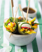 Cucumber and mozzarella rolls with a soya dip