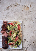 Pork fillet with blueberry glaze and barley salad