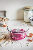 Homemade beetroot pasta dough in a bowl