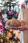 A woman serving Roscon de Reyes (royal cake, Spain) for Christmas