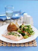 Baked salmon with a baked potato and vegetables