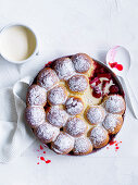 Rhubarb and strawberry casserole with milk bun topping and vanilla sauce