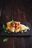 Spinach and ricotta calzone with caprese sauce