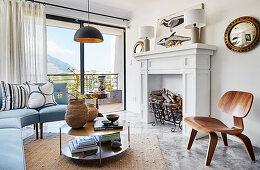 Faux fireplace and glass wall in classic living room