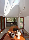 View across kitchen island into living room of architect-designed house