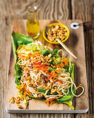 Pasta salad with pork belly, carrots and peanuts (Asia)