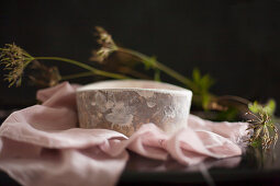 Rustic stoneware bowl on pink cloth